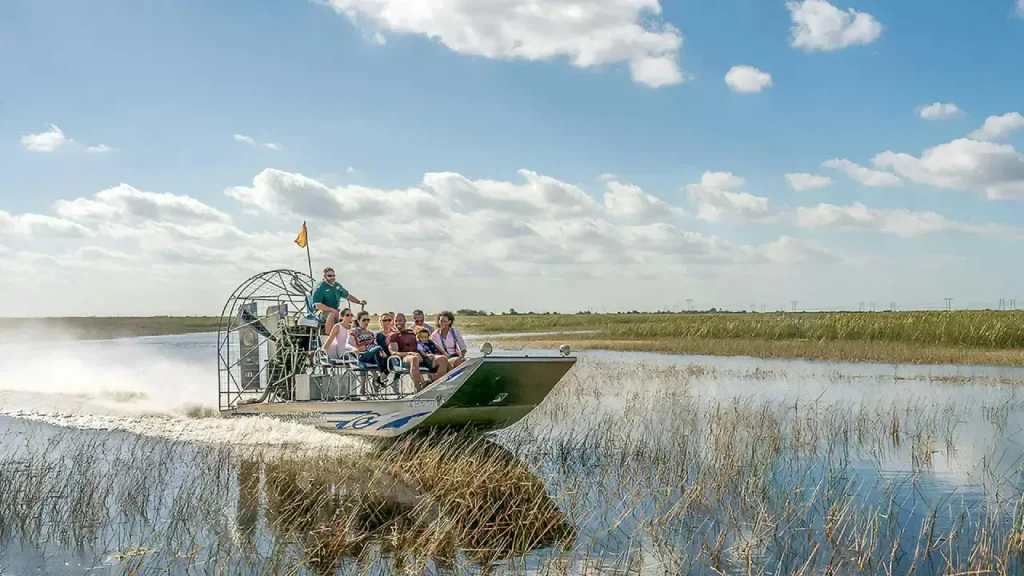 Airboat tour through Everglades sawgrass wetlands